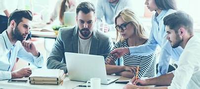 Team members collaborating at Tekstrafin office